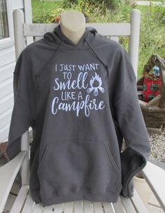 Fall is in the air.... and the Camping is at it's best...  sit around the campfire with this cute hoodie..  8.0 oz., 50/50 cotton/polyester  *Reduced pilling and softer air-jet spun yarn *Double-lined hood with color-matched drawcord (adult style only) *1x1 athletic rib knit cuffs and waistband with spandex *Front pouch pocket *Satin label *Double needle stitching at waistband and cuffs *Quarter-turned Can do in regular Crewneck or in youth sizes and even toddler just message me.   Sweatshirt is Charcoal in Color with white writing... if wanting different color writing please message me. if you are wanting a color I am not showing please message me. Will ship out of the USA  just message me. Comes from a Smoke Free and Pet Free shop Thank you to taking the time to look through my shop... Color Writing, Fall Is In The Air, Around The Campfire, Cute Hoodie, Camping Fun, Soft Air, Embroidered Hoodie, Knit Cuff, Campfire