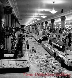 an old black and white photo of the inside of a grocery store with debris on the floor