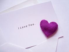 an envelope with a purple heart on it