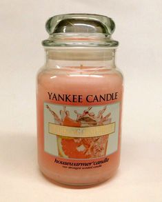 a yankee candle is sitting on a table