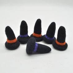 Handmade Felt Witch or Wizard Hats Quantity: 6 felt hats  in total. 6 hats with orange trim, 6 hats with purple trim or 3 hats of each colour.  Please choose your option from the drop down menu. Great for crafting and jewellery making. Please note that these are NOT toys. Size: approx 6cm in height x 3.5cm in width (at base) x 2cm at top of hat Please NOTE: these are handmade felt hats so size does vary. These hats have no threading holes We have tried our hardest to show the colours as accurate Wizard Hats, Handmade Felt Hats, Felt Witch, Purple Trim, Felt Hats, Orange Hats, Purple Hats, Handmade Felt, Felt Hat