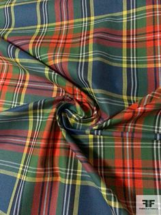 a plaid fabric is shown in red, green and blue