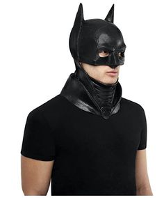 a man wearing a batman mask and black leather choker on top of his neck