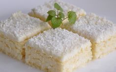 four pieces of cake sitting on top of a white plate