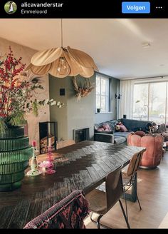 an image of a living room setting with flowers on the table