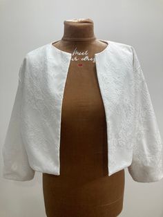 a mannequin with a white jacket on it