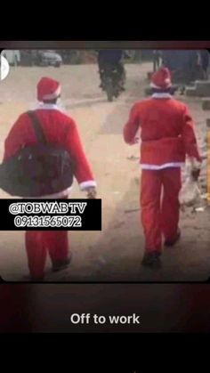 two men dressed in red walking down the street