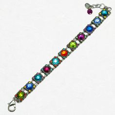 This multi-colored Firefly Rainbow Halley Bracelet is sure to adorn your wrist with a rainbow of delight. This bracelet is a beautiful blend of a contemporary color scheme paired with a classical elegance. Featuring European crystals and Czech glass, this design contains several square charms that are inlaid with a bright gem of some sort. The sparkling pieces, which is most of this bracelet, are sure to catch the light in the most dazzling way. The photos do not do the luminescence justice. You could pair this with other bracelets, but it can totally stand on its own for a moment in the spotlight. Collection: Rainbow Color: Multi-color European crystals, Czech glass Approximately 8 inches long, including a 1.25 inch extender chain Chain is silver-plated antiqued steel Bezel is silver-plat