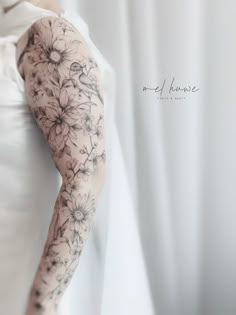 a woman with tattoos on her arm and arms