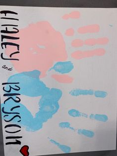 a close up of a sign with hand prints on it