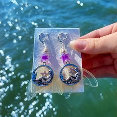 Violet Mermaid resin earrings with real shells 🐚💜 Handmade Mermaid Earrings For Gift, Resin Drop Earrings For Beach, Resin Dangle Earrings For Beach, Purple Dangle Earrings For Beach, Purple Dangle Earrings For The Beach, Nickel-free Ocean-inspired Drop Earrings, Purple Drop Earrings For The Beach, Purple Drop Earrings For Beach, Silver Shell Earrings For Pierced Ears