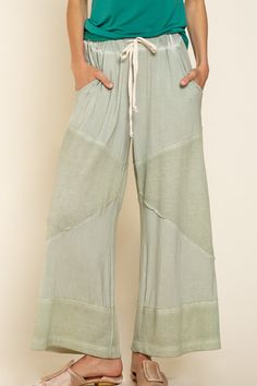 Flowy loose knit culotte palazzo pants featuring ribbed fabrication on contrast and finished with an elastic waistband with adjustable drawstring.  Breezy lounge pants, perfect for outdoor gatherings or walks on the beach. Loose fit Washed soft fabric Front dual pockets Drawstring waistband Fabric: 94% Rayon 6% Spandex Color: Desert Sage Dimensions: Small/Medium:  Waist: 30" Inseam: 24.5" Length: 35" Medium/Large:  Waist: 32" Inseam: 24.5" Length: 35"    Return Policy Items must not be worn or w Desert Sage, Culotte Pants, Style Finder, Loose Knit, Beach Pants, Knit Pants, Drawstring Waistband, Sheer Fabrics, Workout Pants