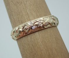 "This half round wedding band can be made in 14k, 18k gold and platinum. Ring is beautify carved with a floral pattern design and millgrained, and high polish all round on all sides. The band is approximately 4.4 mm wide and thickness 1.6 mm. We can make it any size from 5 to 7 and you still be able to return it within the listed time frame. Sizing outside of that range makes it a FINAL SALE. We love this ring because it represents the way jewelry should be made with craftsmanship and quality. T Rose Gold 14k Gold Jewelry With Decorative Band, Engraved 14k Gold Jewelry For Marriage, Gold Wedding Bands With Engraving Option, Engraved Yellow Gold Jewelry For Marriage, Yellow Gold Wedding Jewelry With Engraving Option, Yellow Gold 14k Stamped Jewelry For Marriage, Gold 14k Stamped Jewelry For Marriage, Gold Jewelry Stamped 14k For Marriage, Wedding Rose Gold Jewelry With Hallmarks