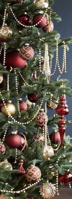 a christmas tree with red and gold ornaments