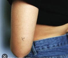 a person with a small tattoo on their arm