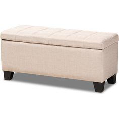 a white bench with black legs and a beige upholstered cushion on it's back