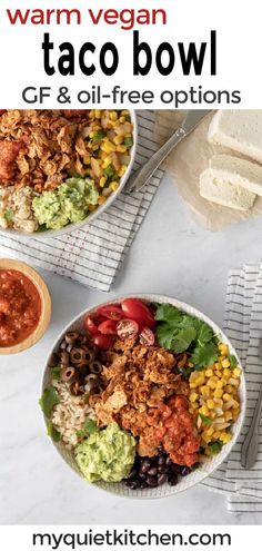 two bowls filled with taco salad and topped with tortilla chips, avocado