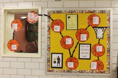 a basketball themed bulletin board hanging on the wall