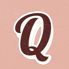 the letter q sticker is shown in red and white on a light pink background