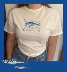 Handmade linocut printed t-shirt for sardine lovers! This design is printed on a pre-washed Gildan 5000 (unisex and heavy cotton) model of t-shirt. I have included the size guide in the images for this product but let me know if you have any questions! Model is wearing a size medium: length of 29 inches and width of 20 inches. This item is made to order so if you would like it printed on with a different color of t-shirt, you can message me to check if the size/color will be available. Or feel f White Hand Printed Crew Neck T-shirt, Hand Printed Organic Cotton T-shirt, Relaxed Fit, Hand Printed Organic Cotton T-shirt In Relaxed Fit, Hand Printed Relaxed Fit Organic Cotton T-shirt, Hand Printed Graphic Tee With Crew Neck, Hand Printed Crew Neck Graphic Tee, Hand-printed Organic Cotton Crew Neck T-shirt, Hand Printed Organic Cotton Crew Neck T-shirt, Organic Cotton Hand Printed Crew Neck T-shirt