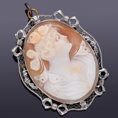 Weight: 9.5 Grams Stone: Cameo Shell Measurements: 43.2 x 34.2 mm Hallmark: 14K  ITEM #:BR-749-080522-17 Luxury Oval Cabochon Brooches, Ornate Oval Carved Brooches, Ornate Carved Oval Brooches, Luxury Oval Jewelry For Opera, Carved Oval Brooch For Formal Occasions, Carved Oval Brooch For Formal Wear, Ornate Oval Engraved Brooches, Carved Oval Brooches For Formal Wear, Antique Oval Carved Brooches