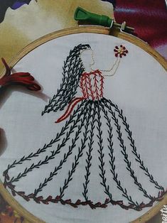 a close up of a embroidery on a piece of cloth