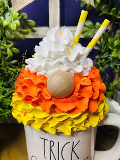 a coffee cup decorated with flowers and candles