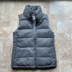 Gray Old Navy Puffer Vest Size Xs. New With Tags. Casual Fitted Winter Vest, Fitted Casual Vest For Cold Weather, Trendy Outdoor Winter Vest, Casual Fitted Outerwear For Outdoor Activities, Gray Outerwear For Spring Outdoor Activities, Gray Winter Vest With Pockets, Black Puffy Vest, Holiday Vest, Navy Puffer Vest