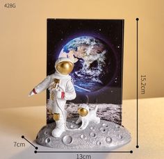 an astronaut and his dog are on the moon, next to a card that says i love you