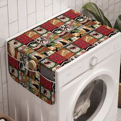 a white washer sitting next to a dryer on top of a tiled floor