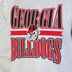 the back of a gray sweatshirt with red and black lettering on it that says georgia bulldogs