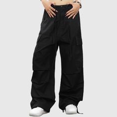 Material: 98% CottonFeatures: Pants, cargo pants, parachute pants, wide legs, pleated, non-elastic, drawstring waist, solid color, straight-leg, relaxed fit, unisex, couple outfits.Style: Casual, college, streetwear Wide Leg Cargo Parachute Pants, Solid Wide Leg Pants With Pockets For Streetwear, Solid Color Baggy Wide Leg Parachute Pants, Solid Baggy Wide Leg Parachute Pants, Solid Color Baggy Cargo Pants In Techwear Style, Baggy Solid Utility Cargo Pants, Baggy Solid Cargo Pants Techwear, Solid Color Baggy Utility Parachute Pants, Baggy Solid Color Utility Parachute Pants