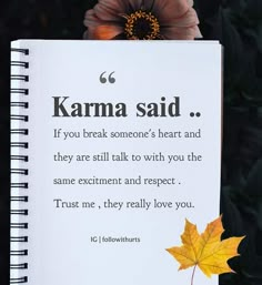 a notepad with a poem written on it and a flower in the background that says, karma said if you break someone's heart and they are still talk to with you