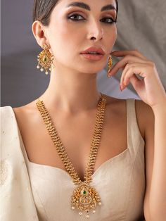 This jewellery set consists of a necklace and a pair of earrings Gold-plated handcrafted necklace, is embellished with artificial stones, and has hook and eye closureA pair of matching drop earrings, secured with post and back closure Size & Fit Necklace Length: 70.5 cmEarrings Length: 6 cm Material & Care Material: BrassPlating: GoldStone Type: Artificial StonesCare Instructions:Wipe your jewellery with a soft cloth after every useAlways store your jewellery in a flat box to avoid accidental scratchesKeep sprays and perfumes away from your jewelleryDo not soak your jewellery in waterClean your jewellery using a soft brush, dipped in jewellery cleaning solution only Dispatch within 7 days Gold Chandbali Jewelry With Stone Setting, Chandbali Necklaces With Matching Earrings For Diwali, 22k Gold Bollywood Jewelry With Matching Earrings, Gold Teardrop Jewelry Sets For Celebration, Gold Dangle Necklace Hand Set, Temple Jewelry Teardrop Matching Earrings, Traditional Gold Plated Teardrop Jewelry, Traditional Teardrop Gold Plated Jewelry, Teardrop Necklace With Matching Earrings For Celebration