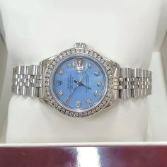 Women's Rolex 26mm DateJust Stainless Steel Watch with Powder Blue Diamond Dial and Diamond Bezel. Pre-Owned Brand: Rolex. Crystal: Sapphire. Dial: Diamond Dial. Gender: Women's. Dial Color: Powder Blue. Movement: Self-Winding. Case Dimensions: 26mm. Metal Type: Stainless Steel. Bezel: Custom Diamond Bezel. Bracelet / Strap: Original Jubilee. Box / Certificate: Rolex Box / Certificate of Authenticity. Service Warranty: One (1) Year Limited Service Warranty. NOTE: This beautiful Rolex watch inclu Rolex 26mm, Diamond Bezel Bracelet, Zenith Watches, Rolex Watches Women, Bezel Bracelet, Rolex Women, White Gold Sapphire, Dior Jewelry, Rolex Watch