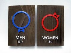 two magnets with the words men and women written in red, blue, and black