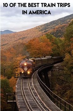 a train traveling down tracks next to trees with the words 10 of the best train trips in america