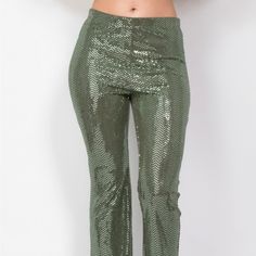 These Sequined Pants Add A Touch Of Glam To Your Formal Wear. The Mid-Rise Elastic Waistband And Flared Leg Create A Comfortable And Flattering Fit, While The Full Length Adds A Touch Of Sophistication. Key Features: - Fabric: 88% Polyester, 6% Metallic, 6% Spandex For A Comfortable Stretch And Glamorous Finish. - Fit: Mid-Rise With An Elastic Waistband And Flared Leg For A Flattering Silhouette. - Color Options: Available In Olive. - Sizes: Available In S, M, L. - Design: Features Dazzling Sequ Green Sequined Bottoms For Night Out, Green Bottoms For Night Out Party, Green Bottoms For Night Out, Fitted Ankle-length Party Pants, Green Sequined Party Bottoms, Green Chic Bottoms For Party Season, Green Wide Leg Full Length Pants For Party, Green Sequined Bottoms For Spring, Spring Green Sequined Bottoms