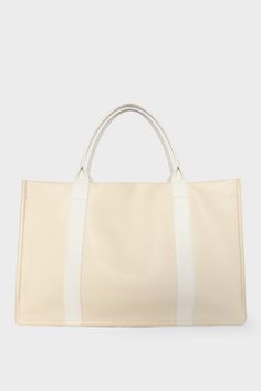 A large white tote bag with a rectangular body. It has a wide top with a magnetic closure. The bag has 2 handles to be carried handheld or as a shoulder bag. Elegant Large Capacity Weekender Bag For Shopping, Chic Rectangular Weekender Bag For Errands, Chic Rectangular Weekender Bag, Classic Cream Bags With Rolled Handles, Beige Weekender Bag For Shopping, Leather Shoulder Bag With Reinforced Double Handles, Elegant Top Handle Weekender Bag For Shopping, Leather Shoulder Bag With Double Handle And Reinforced Handles, Top Handle Weekender Bag For Shopping