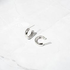 Beautiful chunky style small hoop earrings. They are bold yet still minimalist and compliment many different styles and looks! They are super on trend! Made of 925 Sterling Silver THICK plating of 14k Gold or Rhodium Nickel-Free & Hypoallergenic Inner Diameter: 16mm Thickness: 5mm Sold as a pair Earrings On Model: Studs, Huggies Modern Nickel-free Hoop Earrings For Everyday, Everyday Modern Nickel-free Hoop Earrings, Modern Small Hoop Huggie Earrings For Pierced Ears, Modern Polished Hoop Earrings For Everyday, Trendy Small Hoop Sterling Silver Huggie Earrings, Trendy Sterling Silver Small Hoop Huggie Earrings, Trendy Small Hoop Huggie Earrings In Sterling Silver, Trendy Sterling Silver Huggie Earrings For Everyday Wear, Trendy Everyday Sterling Silver Huggie Earrings