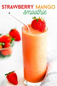 a strawberry mango smoothie in a glass with strawberries on the side and text overlay that reads, strawberry mango smoothie