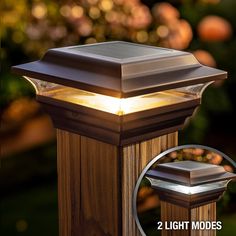 an outdoor post light with two lights on each side and the top half lit up