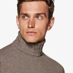 This soft taupe knitted sweater is
 tailored slim with a ribbed hem and cuffs, and heavy turtleneck collar. Formal Winter Sweater With Ribbed Collar, Elegant Formal Polo Sweater For Fall, Formal Beige Sweater For Winter, Classic Wool Turtleneck With Ribbed Collar, Winter Beige Sweater For Formal Occasions, Classic Solid Funnel Neck Turtleneck, Classic Turtleneck Polo Sweater For Fall, Elegant Wool Sweater For Business, Elegant Business Tops For Winter