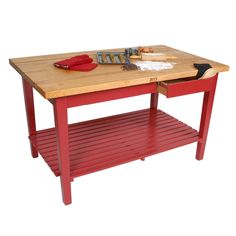 a red table with a butcher block on top and shelf underneath it for storing food