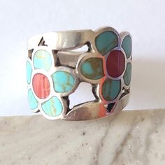 An impressive sterling silver ring from 70s. The ring is enameled with turquoise blue and coral red featuring a gorgeous floral design with two big flowers that look like daisies.  The ring is approximately 6.5 in size. It is rather thick and weighs 7.21 grams. It is in excellent condition and has a unique touch. It will make an excellent gift for any occasion! The ring comes in a gift box and with a 'Thank you' card. For more items in my store visit: https://nostalgicbyliliya.etsy.com 21 Grams, Blue Coral, Design Statement, Best Gifts For Her, Daisy Flowers, Coral Red, Big Flowers, Coral Blue, Daisy Flower