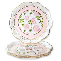 two plates with pink roses on them and gold trimmings, one is empty