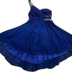 Studio City Jeweled Cobalt Blue Cocktail Formal Party Homecoming Dress Size 7. Gorgeous Dress Great For Any Formal Occasion. Color Is A Darker Blue, Tag Reads “Cobalt Blue/Homecoming Blue”. Multiple Layered Skirt. Approximate Measurements Laying Flat And Zipped: Bust: 15” Waist: 13.5” Front Length From Bust: 33” Msrp: $99.00 New With Tags. Ships Worldwide By Next Business Day Blue One-shoulder Mini Dress For Prom, Royal Blue One-shoulder Dress For Night Out, Royal Blue A-line Mini Dress For Party, Blue A-line Formal Dress, Blue Cocktail Dresses For Prom Season, Blue Cocktail Dress For Prom, Royal Blue A-line Evening Dress, Blue Evening Dress For Homecoming Party Season, Royal Blue One-shoulder Evening Dress