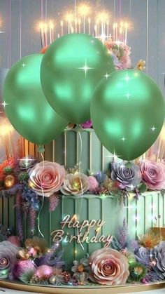 a birthday cake with three green balloons and flowers on top, surrounded by other decorations