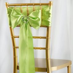 a chair with a green bow tied to it