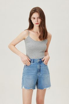 Timeless Casual Chic with High-Waist Denim Jorts Crafted from premium fabric, these high-waisted denim jorts offer a dry, comfortable feel. The soft, wrinkle-resistant material keeps you looking neat. The high-waist design accentuates a slender waist, while the frayed hem adds a unique edge. Perfect for any casual look and essential for your summer wardrobe. Style #: WWAJ034 Denim Top In Medium Wash, High Waist Cotton Tops With Frayed Hem, Denim Blue Short Length Denim Tops, Light Wash Denim Crop Top, Light Wash Denim Short Tops, Light Wash Denim Top In Short Length, Light Wash Short Denim Top, High Waist Denim Tops With Frayed Hem, Spring Denim Blue Recycled Jean Shorts